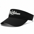 Black visor with 'The Kitchen' text on a white background
