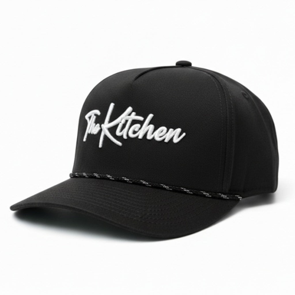 Black cap with 'The Kitchen' logo on a white background