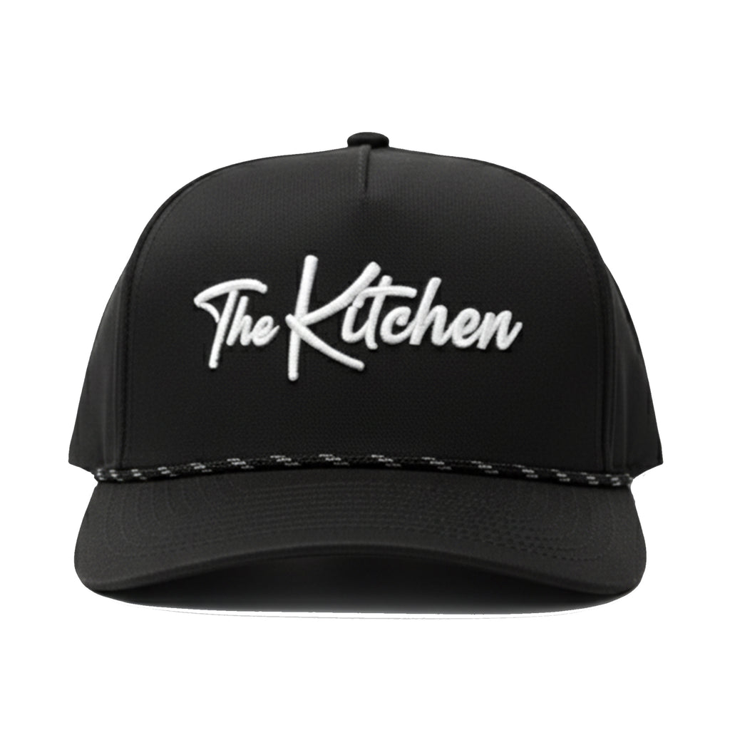 Black cap with 'The Kitchen' embroidered on a white background
