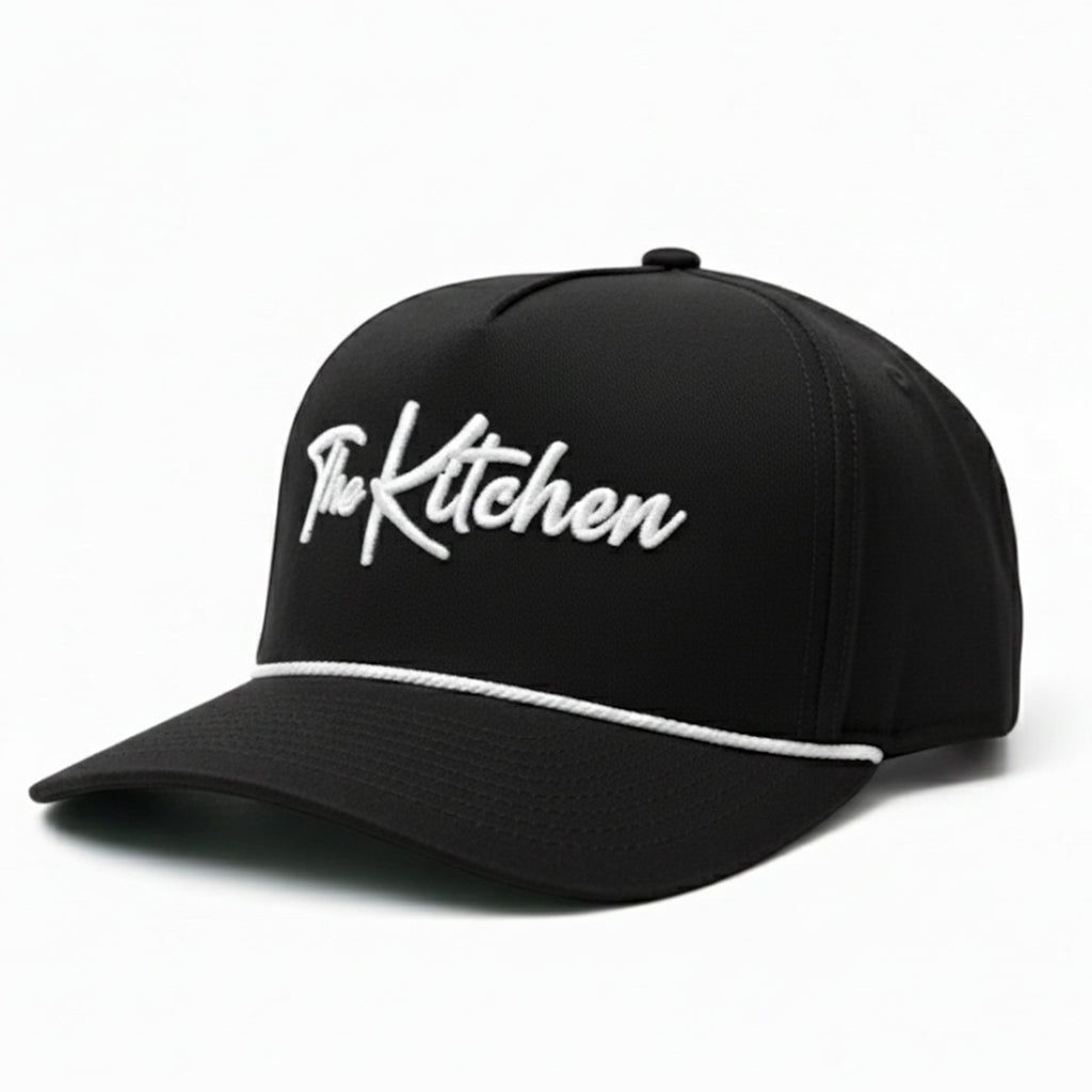 Black cap with 'The Kitchen' text on a white background