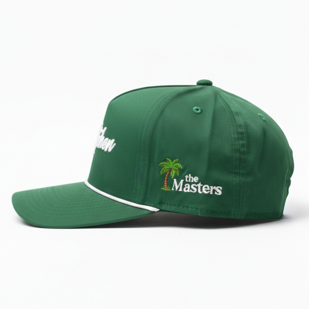 Green cap with 'the Masters' logo on a white background