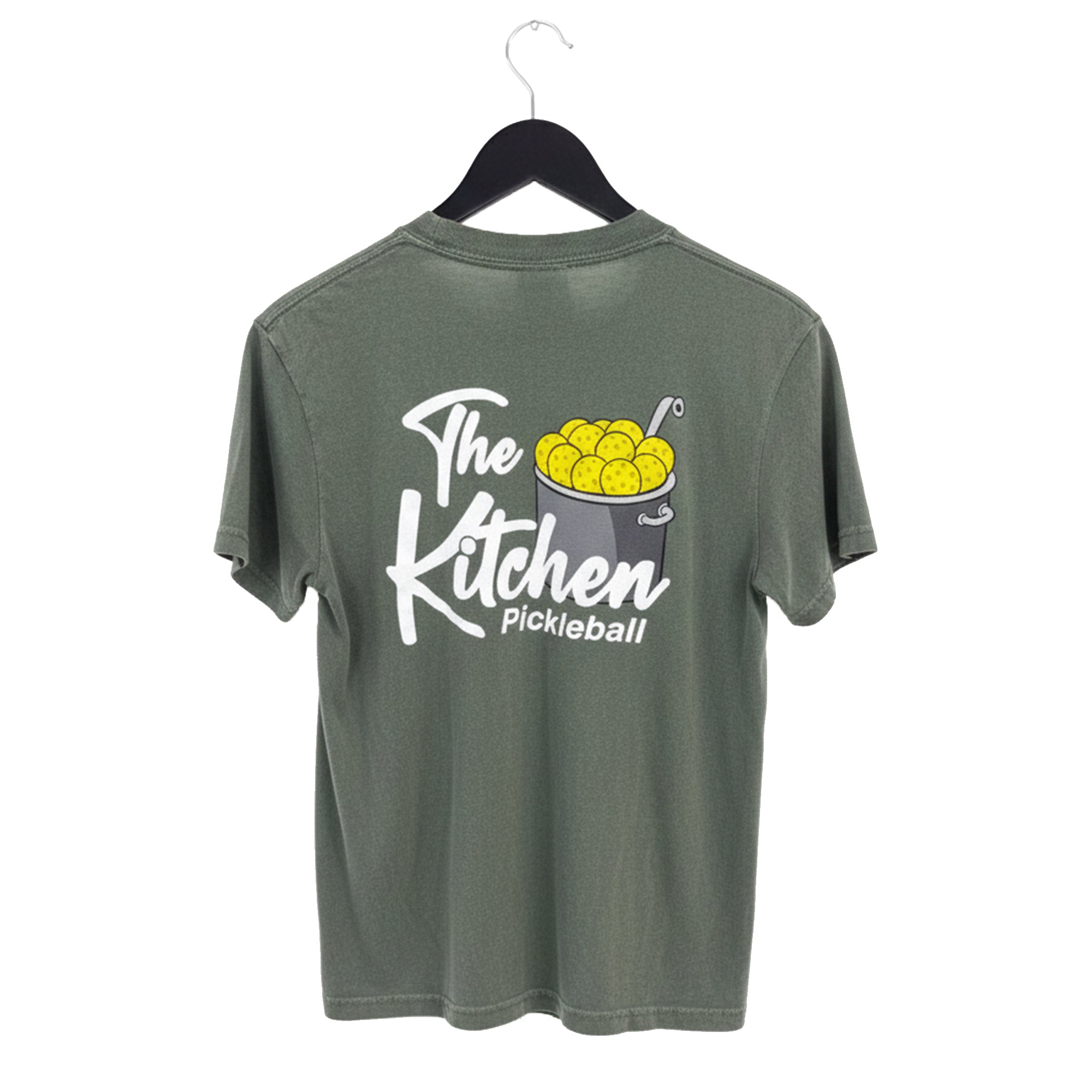 Green t-shirt with 'The Kitchen Pickleball' design on a hanger against a white background