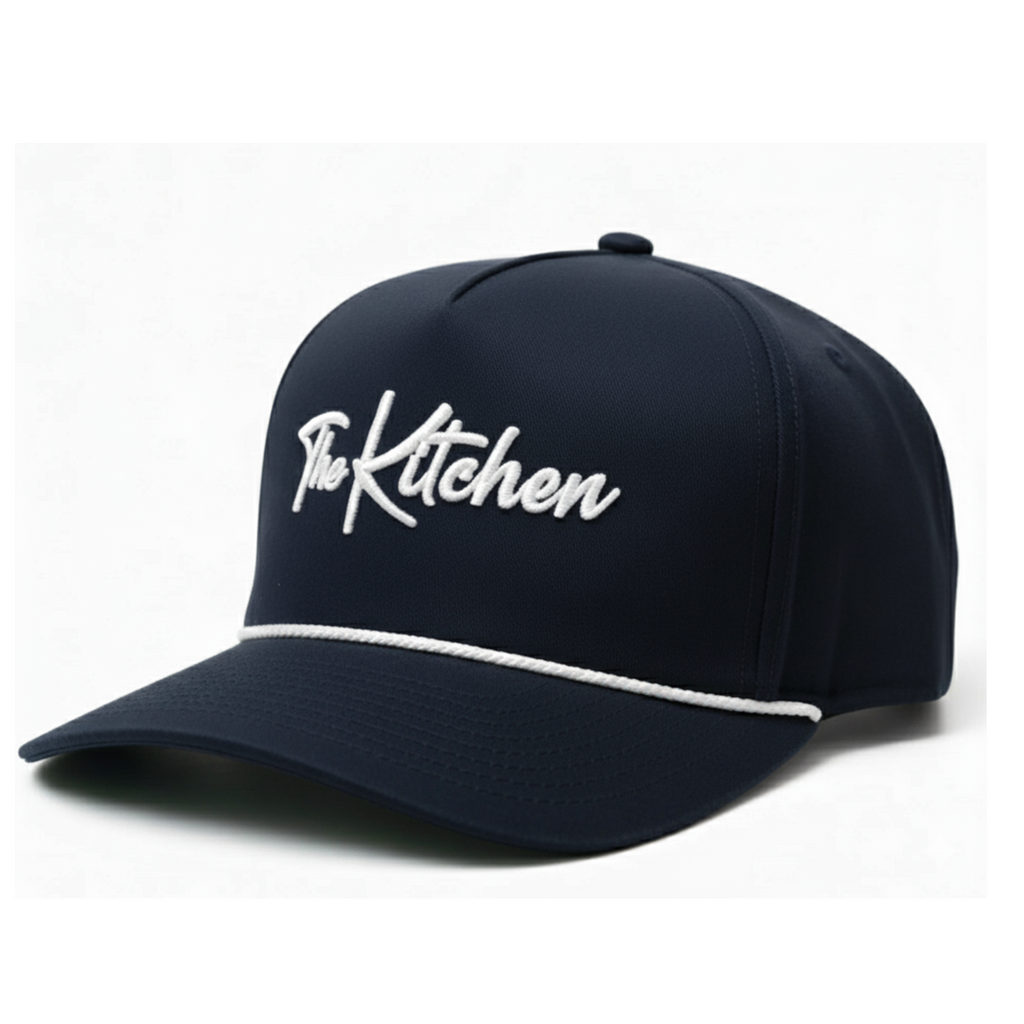 Navy blue cap with 'The Kitchen' logo on a white background