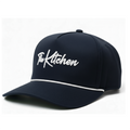 Navy blue cap with 'The Kitchen' logo on a white background