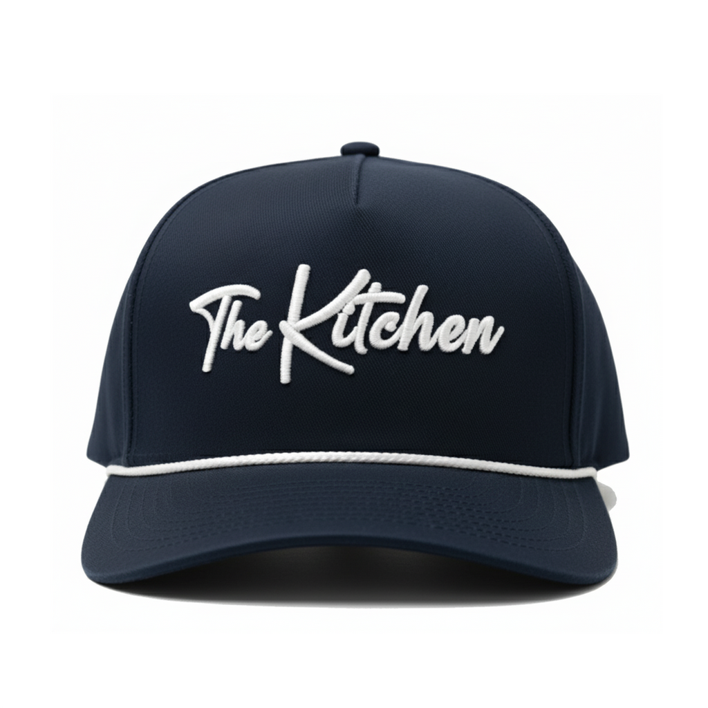 Navy blue cap with 'The Kitchen' logo on a white background