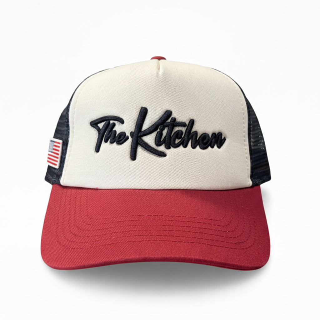 Trucker hat with 'The Kitchen' logo on a white background