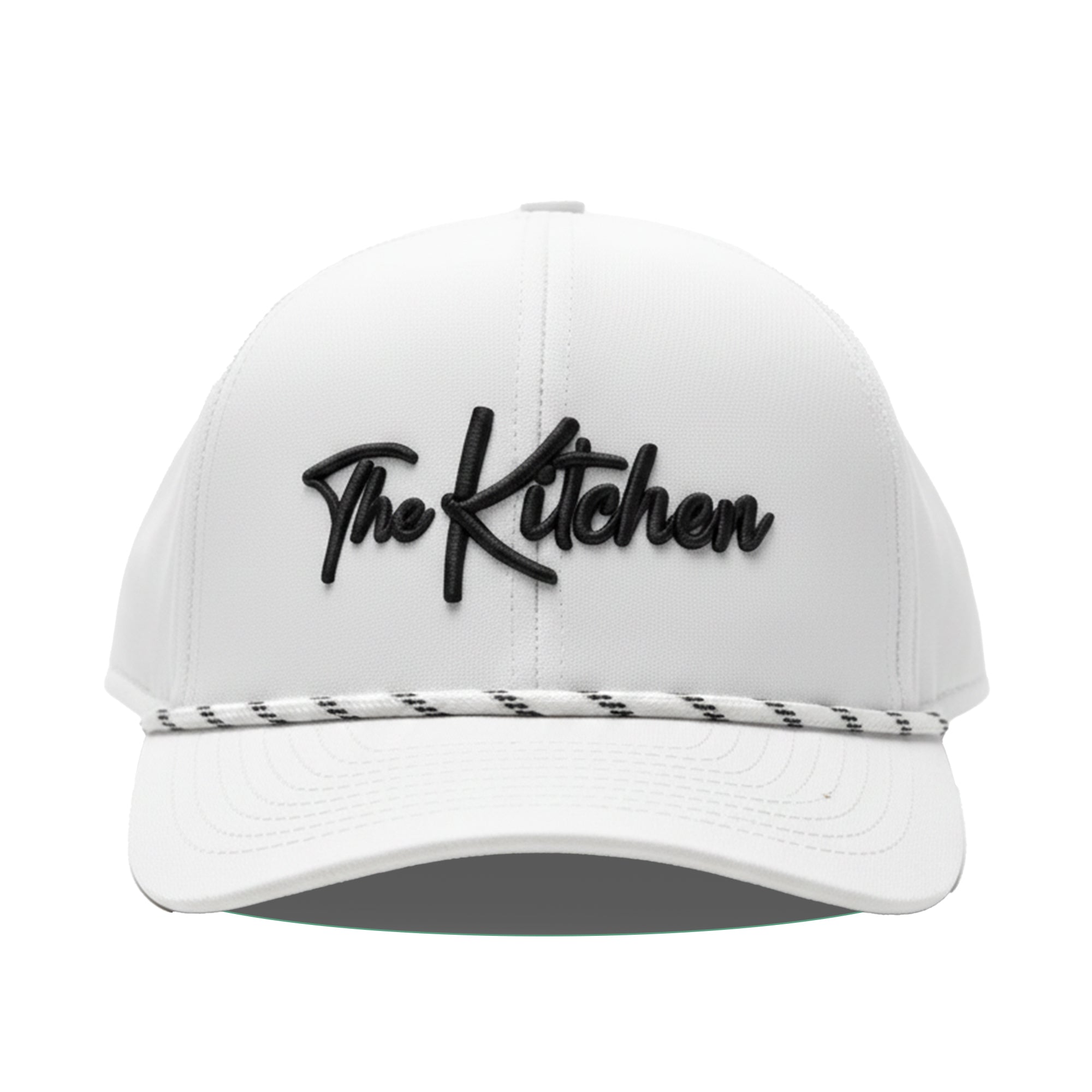 White cap with 'The Kitchen' logo on a white background