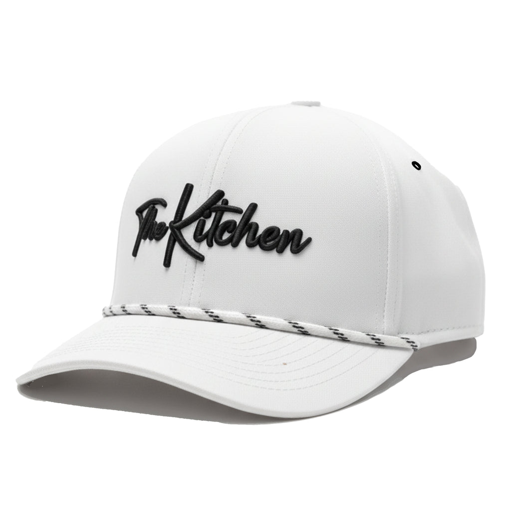 White cap with 'The Kitchen' logo on a white background