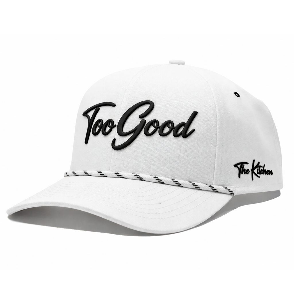 White cap with 'Too Good' and 'The Kitchen' text on a white background